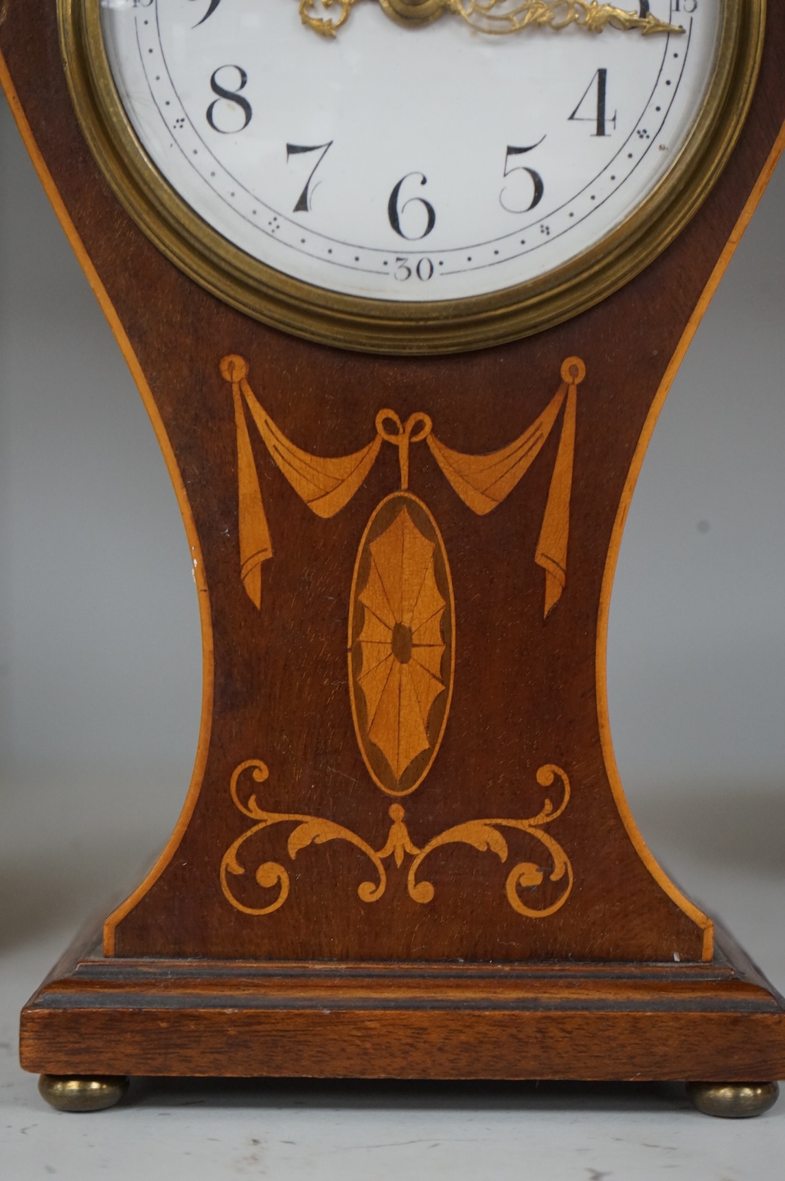 An Edwardian inlaid mahogany mantel timepiece, 28cm high
